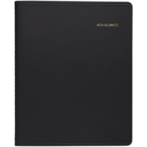 A black At-A-Glance appointment book with gold writing on the cover.