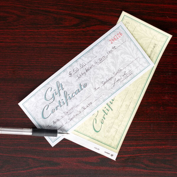 An Adams 2-part carbonless gift certificate with envelope and a pen.