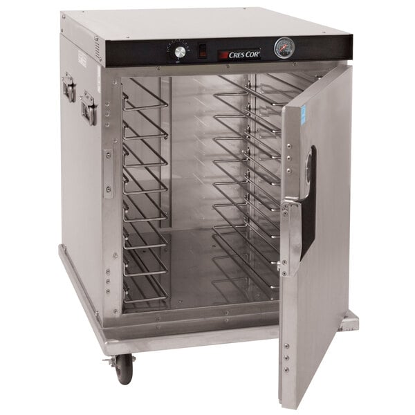 A large stainless steel holding cabinet with a door open.