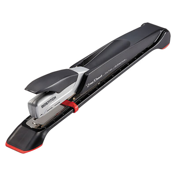 A black stapler with a red and silver handle.