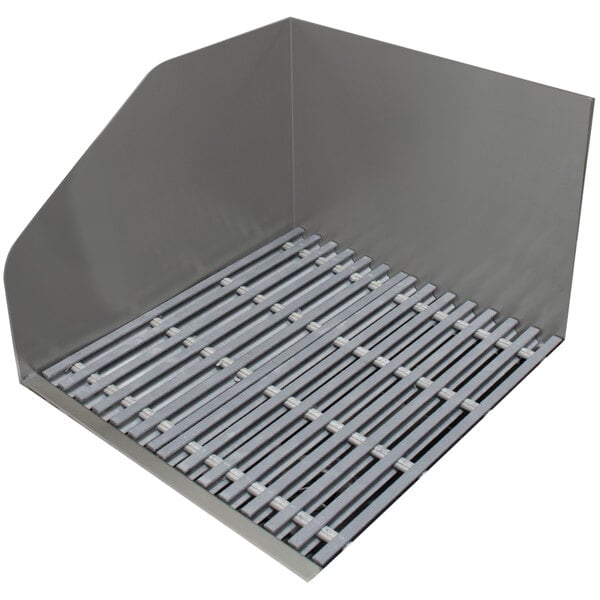 A metal grate covering a mop sink with a fiberglass grate.