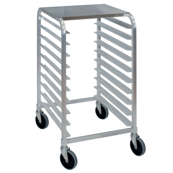 A Cres Cor stainless steel half height sheet pan rack with wheels holding trays.