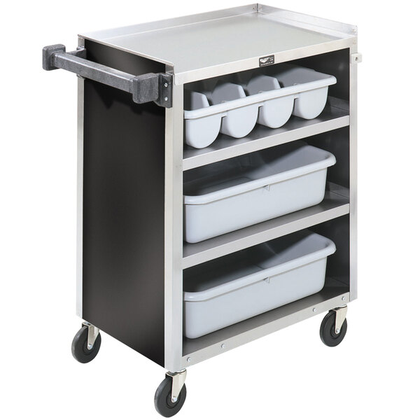 A Vollrath metal bussing cart with shelves holding a white plastic container.