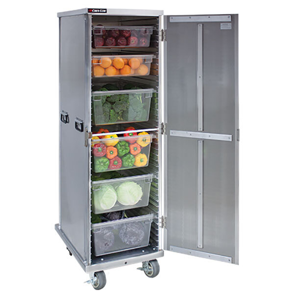 A silver Cres Cor sheet pan rack with a door open and filled with vegetables.
