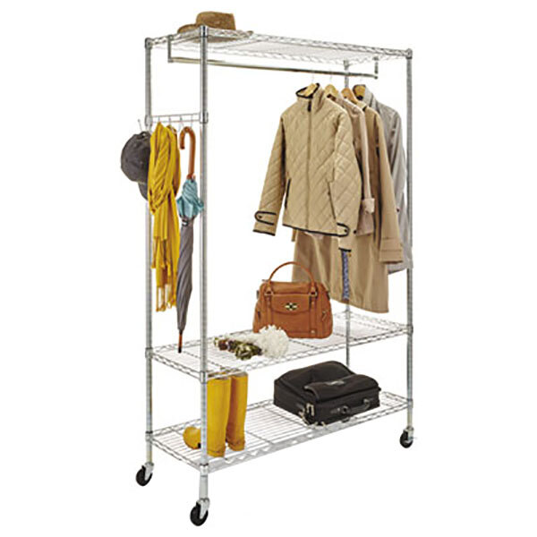 A silver metal Alera wire shelving garment rack with clothes and bags.