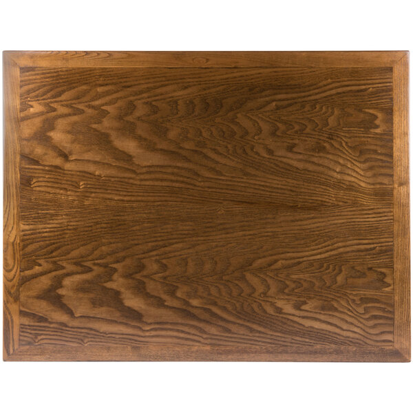 A BFM Seating Autumn Ash veneer wood table top with a dark wood grain.