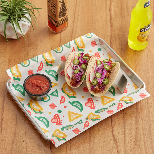 A tray with a Choice Mexican Print Deli Wrap Paper-lined tacos and salsa on it.