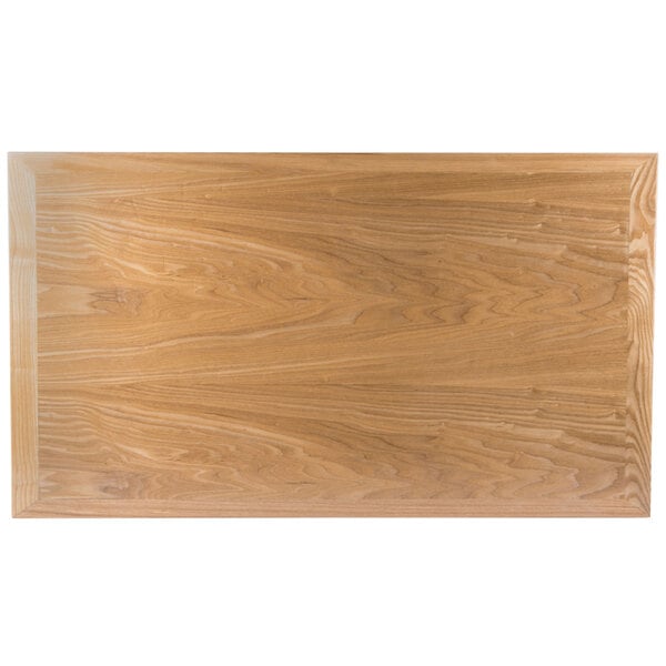 A close-up of a BFM Seating natural wood veneer table top.