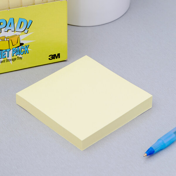 A 3M yellow Post-It note pad.