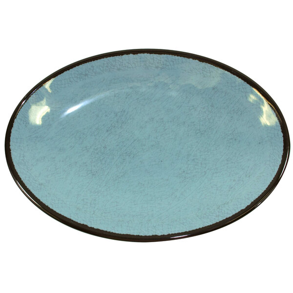 An oval blue Elite Global Solutions melamine plate with a black rim.
