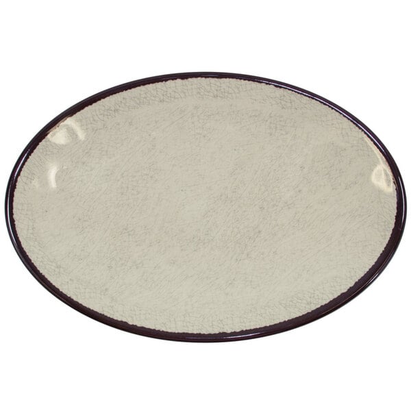 An oval white Elite Global Solutions melamine plate with a black rim.