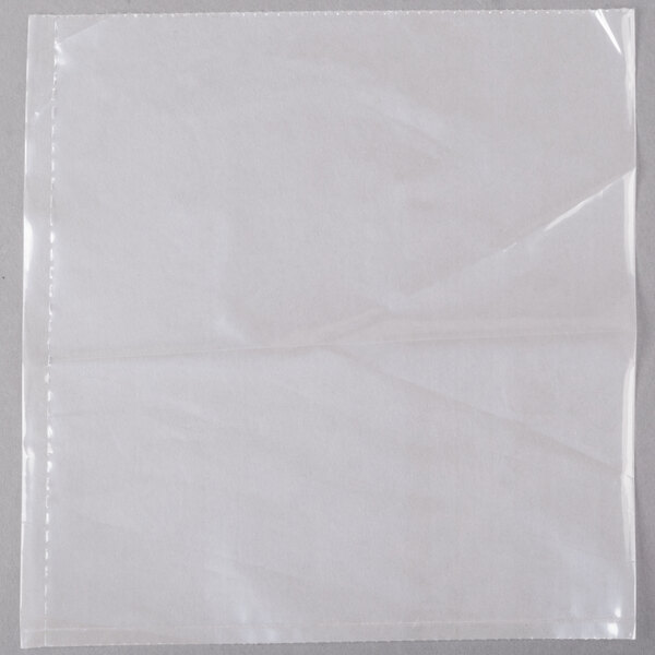 A roll of LK Packaging plastic food bags with a white square object inside.