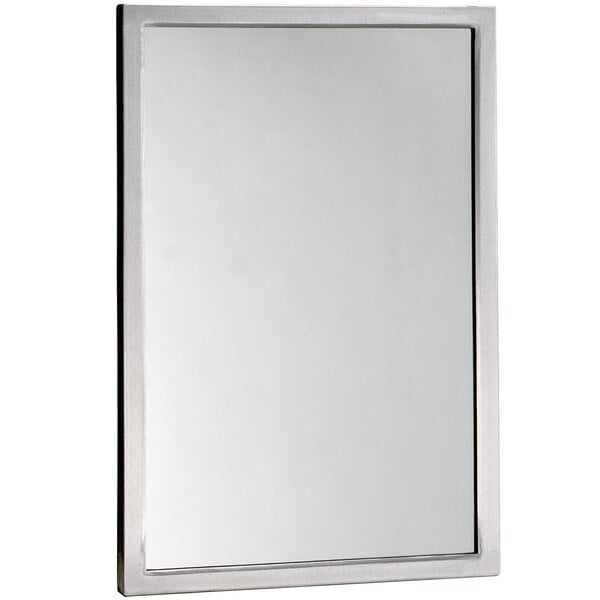 A white rectangular mirror with a silver frame.