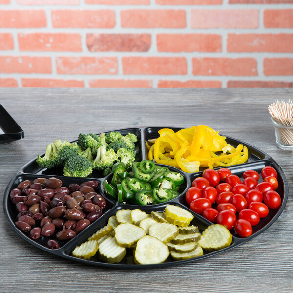 A black Fineline plastic catering tray with 6 compartments holding vegetables.