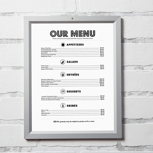An Aarco aluminum slide frame holding a menu on a white wall.