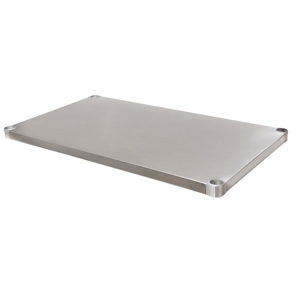 A stainless steel undershelf with holes for a metal table.