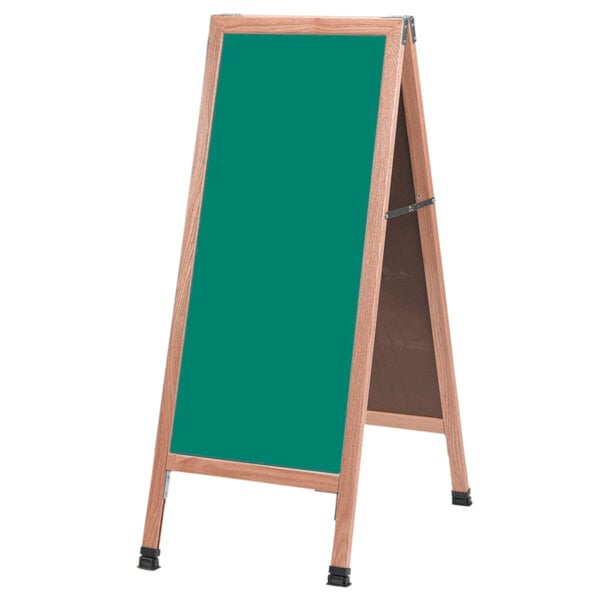 An oak A-Frame sign board with a green chalkboard on it.