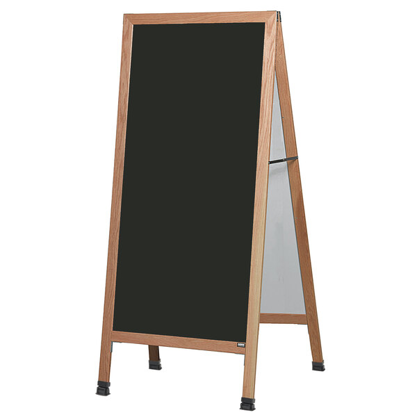 An Aarco oak A-frame sign board with a black write-on porcelain marker board.