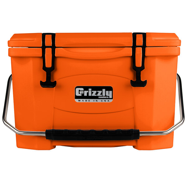 An orange Grizzly cooler with black handles.