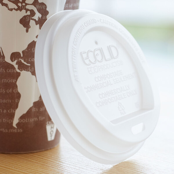 A close-up of an Eco-Products compostable plastic coffee cup lid on a coffee cup.