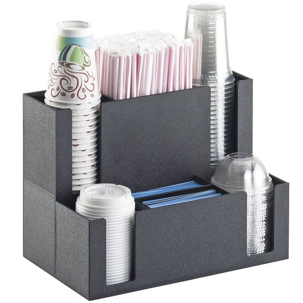 A black Cal-Mil countertop cup and lid organizer with a variety of cups and straws.