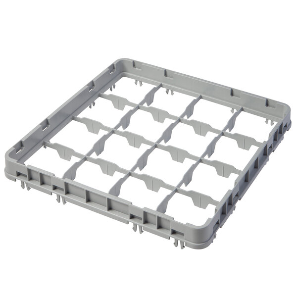 A grey plastic tray extender with 16 compartments and holes.
