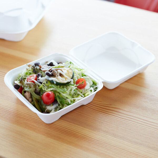 A salad in a white Eco-Products compostable takeout container.