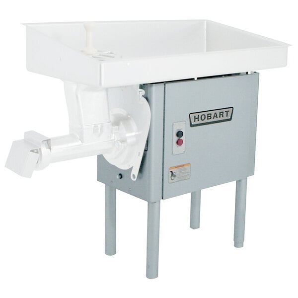 A white Hobart meat chopper with a white tray on top.