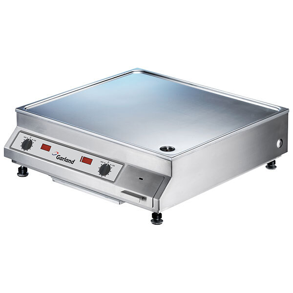 A silver Garland Dual Countertop Induction Griddle with knobs.