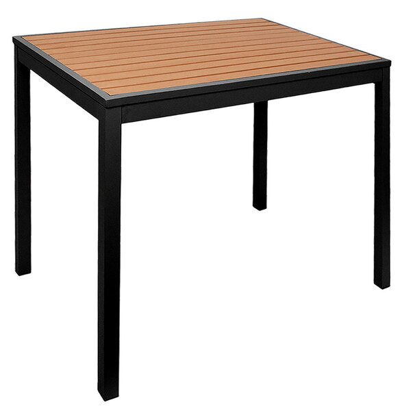 A BFM Seating Longport standard height table with a synthetic teak top and black aluminum base.