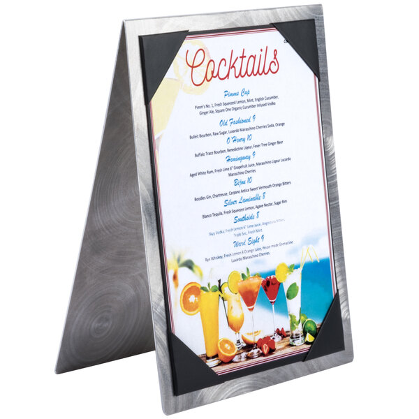A Menu Solutions aluminum menu tent with picture corners displaying a menu with drinks on it.