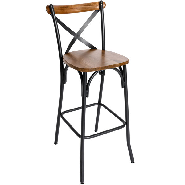 A BFM Seating black steel bar stool with a wooden back and seat.