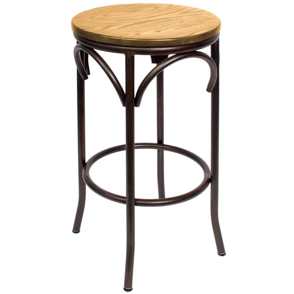 A round wooden BFM Seating bar stool with metal legs.