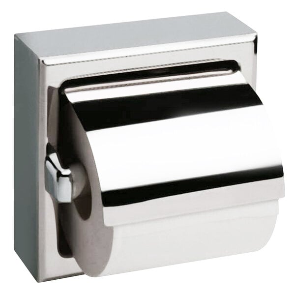 A Bobrick satin finish stainless steel toilet paper holder with a roll of toilet paper.