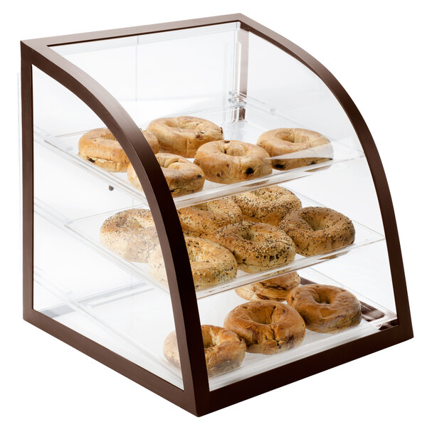 A Cal-Mil iron bakery display case with bagels on it.