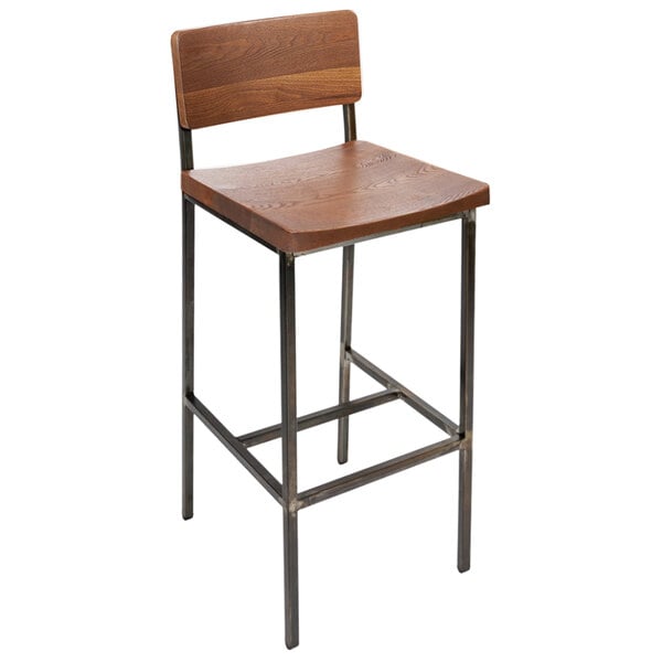A BFM Seating Memphis bar stool with a wooden back and seat, and metal legs.