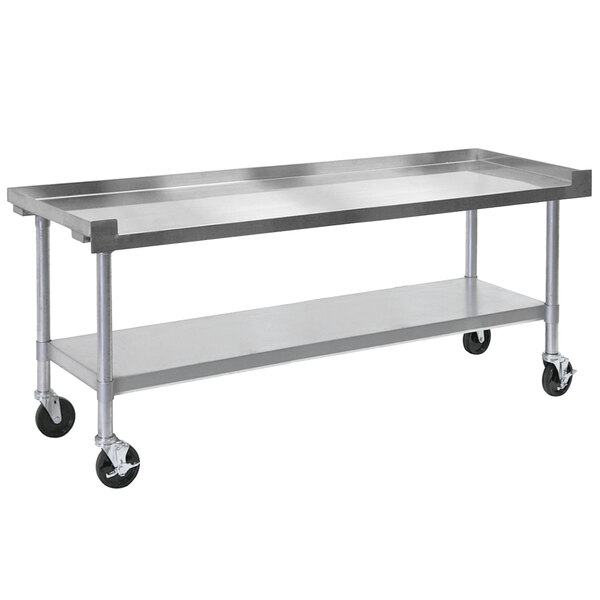 A large stainless steel table with wheels.