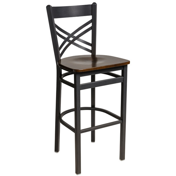 A BFM Seating black steel bar stool with a wooden seat and back.