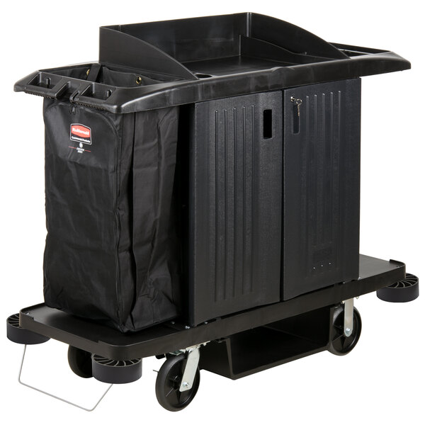 A black Rubbermaid housekeeping cart with a black bag on it.