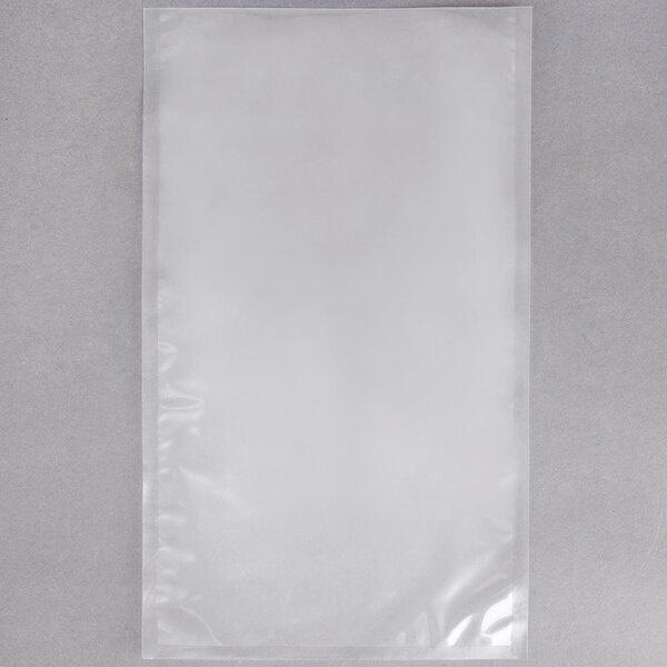A white plastic ARY VacMaster vacuum packaging bag on a gray surface.
