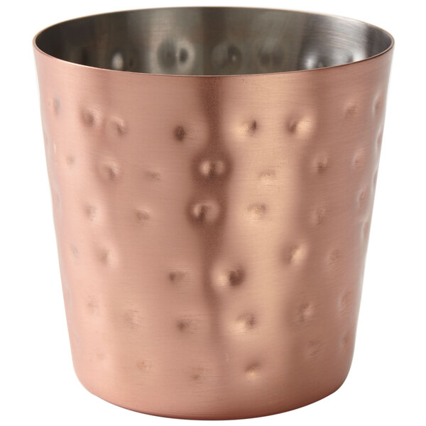 An American Metalcraft hammered copper French fry cup with a metal handle.