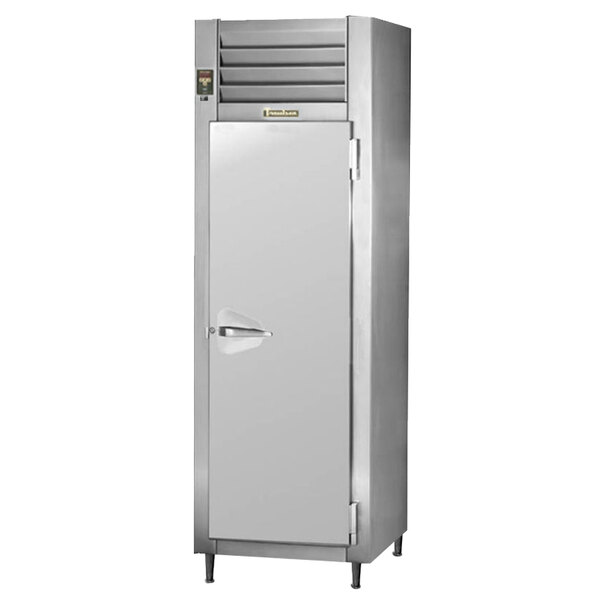 A Traulsen stainless steel reach-in refrigerator with a door open.