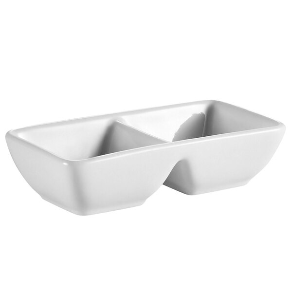 A white rectangular porcelain tray with two sections.