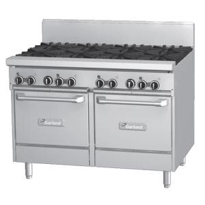 A large stainless steel Garland gas range with 8 burners and 2 ovens.
