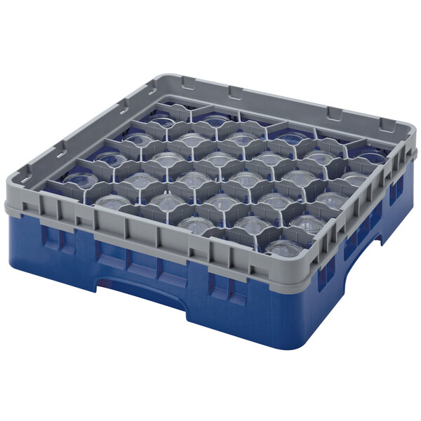 A navy blue and gray plastic Cambro glass rack with clear circles inside.