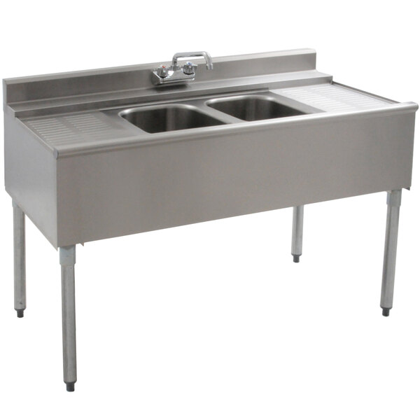 A stainless steel Eagle Group underbar sink with two compartments and two drainboards.