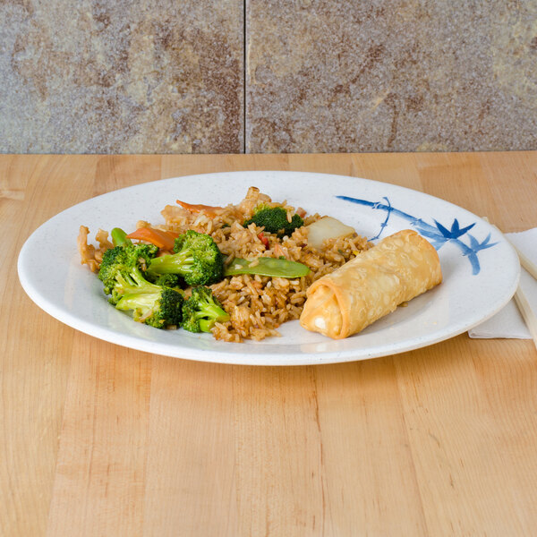 A Thunder Group Blue Bamboo melamine plate with broccoli and rice on it.