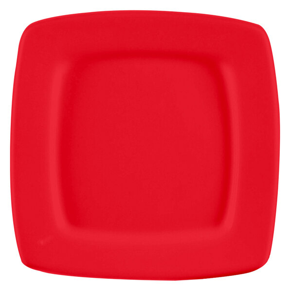 A red square stoneware plate with a white square in square design.
