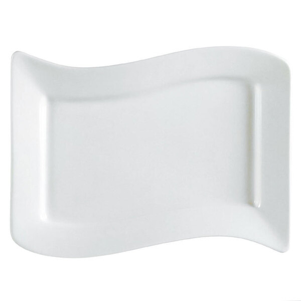 A CAC ivory rectangular stoneware platter with a curved edge.