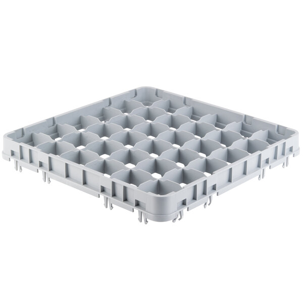 A white plastic Cambro rack with holes for 36 stemware glasses.